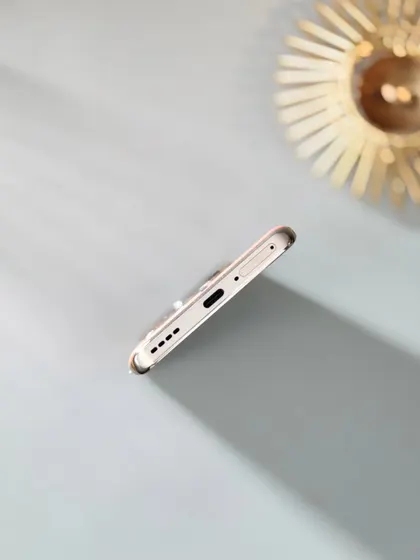 A minimalist, artistic shot of the Realme 12 Pro+ that plays with light and shadow to create a visually interesting composition.