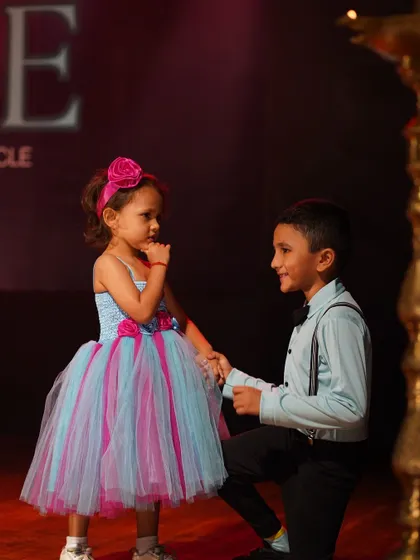 A sweet, choreographed interaction between our youngest performers on the big stage. We teach partnership and teamwork from an early age.