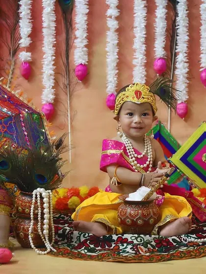 My little Krishna for Janmashtami! I adore creating these special themed photoshoots for festivals. The vibrant colors, the detailed setup, and that adorable smile make this a memory to cherish forever.