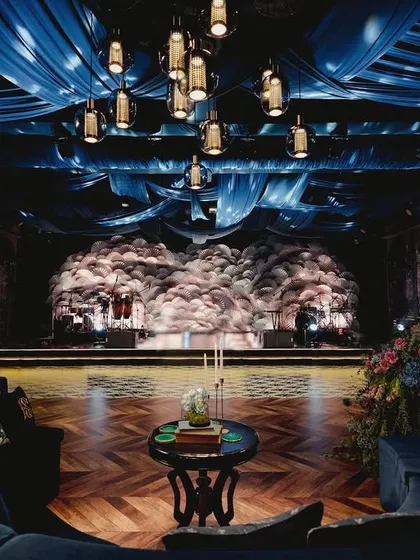 The 'Midnight Mirage' sangeet, inspired by the deep hues of cobalt. We crafted a mesmerizing setting that embraced the magical elements of the earth, weaving elegance with a touch of glam.