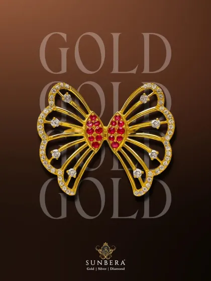 This exquisite butterfly piece, crafted in gold with ruby and diamond accents, is a versatile design. While perfect as a centerpiece for a luxurious rakhi, it can also be used as a brooch or a pendant, making it a gift that keeps on giving.