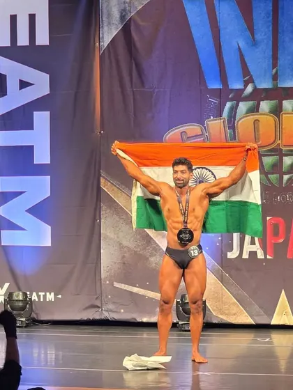 A proud moment on the INBA stage in Japan, holding the Indian flag. This is what we train for.