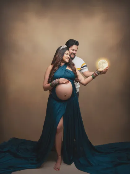 In this magical moment, we captured the pure joy and anticipation of this couple as they hold a glowing moon, awaiting their little moonbeam.
