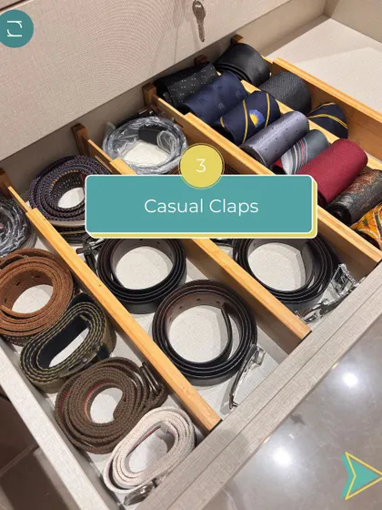 A peek into an organized men's accessory drawer, with belts and ties neatly rolled and separated for easy access.