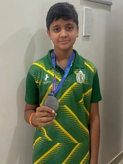 Shashwat Singh proudly holds his silver medal for the 100m Backstroke at the SFA Championships in Bengaluru.