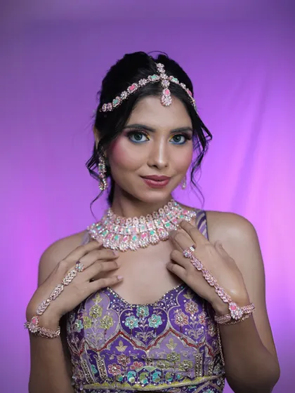 The complete look, showcasing the stunning jewelry set against the vibrant makeup. The colorful eyeshadow and blue contacts create a unique and memorable style.
