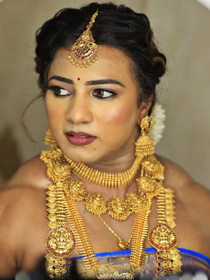 A moment of reflection, showcasing the beautiful details of the traditional makeup and jewelry that contrast with my powerful physique.