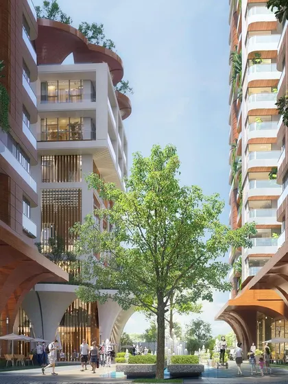 This render shows the space between the two luxury towers, designed as a vibrant, tree-lined plaza. The architecture at the ground level is crafted to encourage pedestrian activity and create an inviting, public-friendly atmosphere.