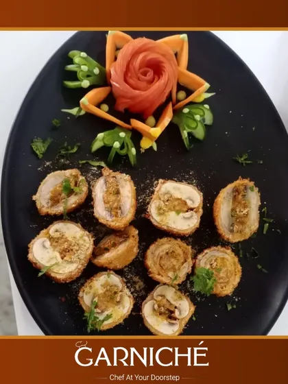 Attention to detail is what sets a meal apart. We take pride in not just the taste but also the presentation, like with these intricately prepared and garnished stuffed mushrooms, a favorite appetizer for many parties.