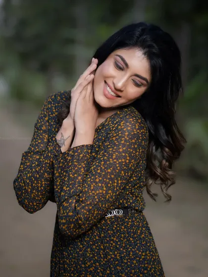 A smiling, happy version of the outdoor portrait. This shows the model's range of expression.