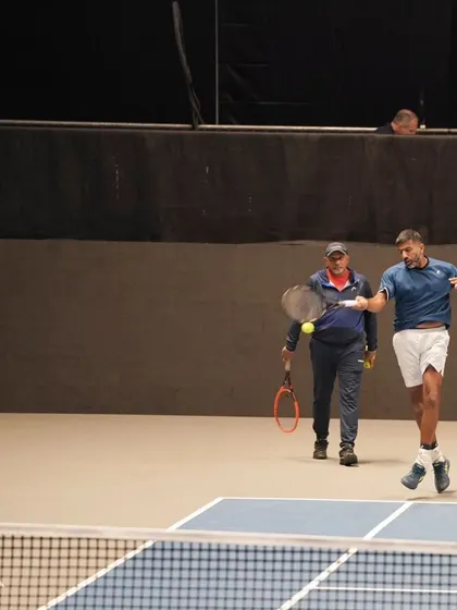 Practicing with my coach before a match in Vienna. Preparation is everything.