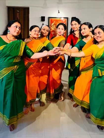 Our dance family holding hands, symbolizing our unity and collective spirit.