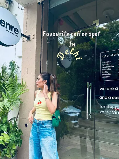 Posing outside my favorite coffee spot in Delhi.