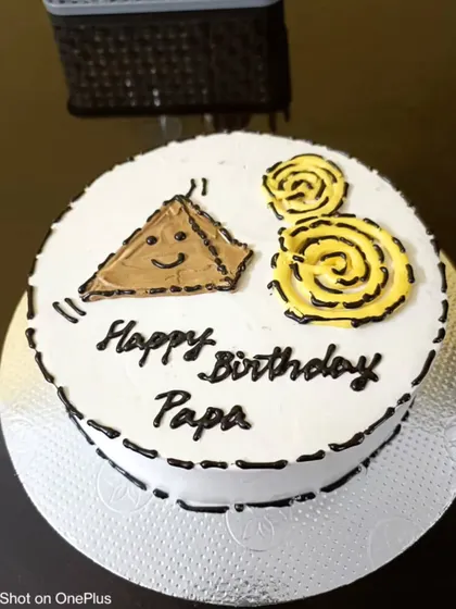 A fun and unique cake for "Papa" featuring his favourite snack combo: samosa and jalebi!