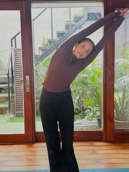 A standing side bend, this pose is wonderful for stretching the intercostal muscles and improving spinal flexibility.