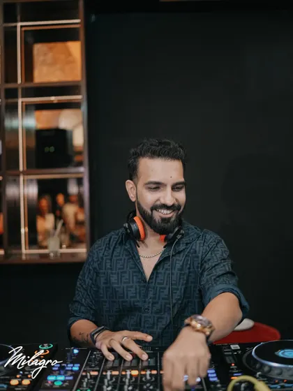 A clear, smiling shot of me at the Milagro console. It's all about good vibes and great energy.