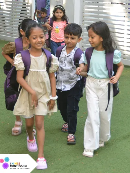 Children walk together, hand in hand, showcasing the friendships and sense of community that are built within our walls.
