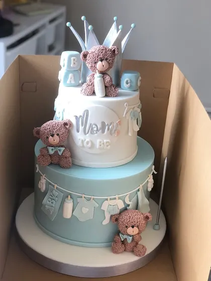 The cutest two-tiered "Mom to Be" cake with a teddy bear theme, perfect for a baby shower.