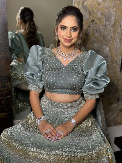 Sangeet glam goals. This look features soft yet defined smokey eyes and a hint of sparkle, designed to make any bride-to-be feel like a star on her big day.