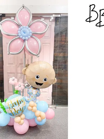 Oh boy! This Boss Baby arrangement is perfect for celebrating the arrival of a little prince or for a first birthday. The character balloon is paired with a soft blue and pink color scheme and a large balloon flower.