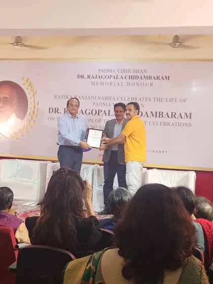 A proud moment receiving an award in front of an audience. My journey is a testament to what can be achieved with hard work and the blessings of God.