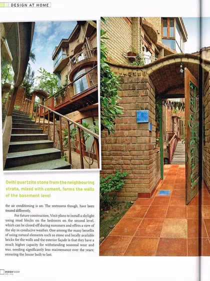The entrance to a home should be a transition from the outside world into a personal sanctuary. Here, the pathway is framed by walls of Delhi quartzite stone and an arched brick gateway, materials sourced locally for their durability and character. The design invites a connection with the natural elements from the very first step.