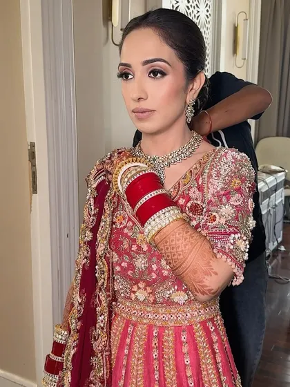 A final check before she heads out. I always make sure every detail is perfect and the bride is completely happy with her look.