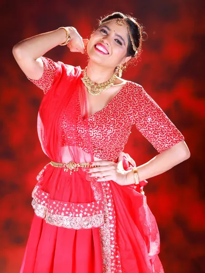A fun and energetic pose from our red lehenga shoot. This kind of shot adds personality and life to a fashion portfolio.