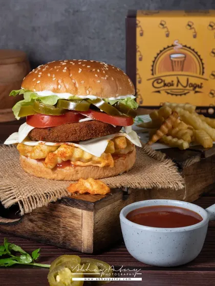 Here, I used a dark and moody setup to create a dramatic burger shot. The fries and branded box in the background provide context and reinforce the brand's identity.