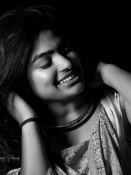 A black and white version of a joyful studio portrait. Good makeup looks just as stunning in monochrome, as it's about defining shapes and textures.