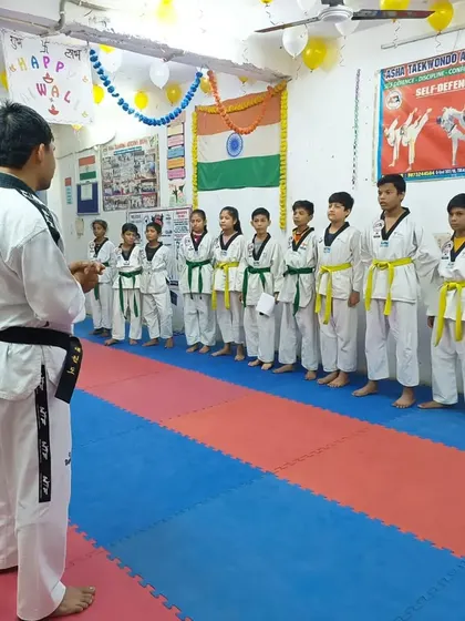 I am addressing the students before their belt test, explaining the requirements and offering words of encouragement.