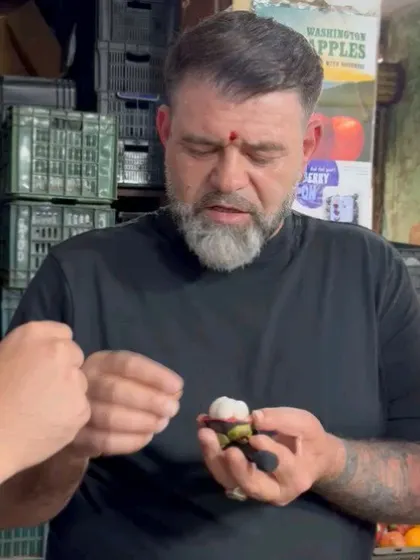 Passion is fueled by purpose and discovery. Chef Guram carefully inspects a mangosteen, a moment that reflects the deep respect for ingredients that defines all the chefs I collaborate with.