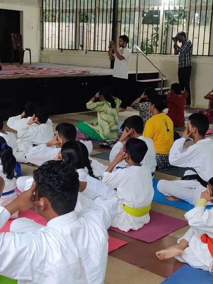 A group of our students practicing Bhramari Pranayama (Humming Bee Breath). These calming techniques are an important part of our holistic approach to martial arts and fitness.