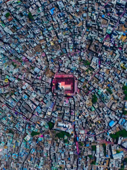 A top-down view of the temple in Barsana, the epicenter of the Holi celebrations. The entire town seems to radiate outwards from this central point of devotion.