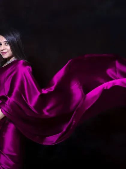 For a touch of desi elegance, a satin saree in the studio creates a stunning and dramatic look. The way the fabric flows highlights your beautiful bump with grace and style.