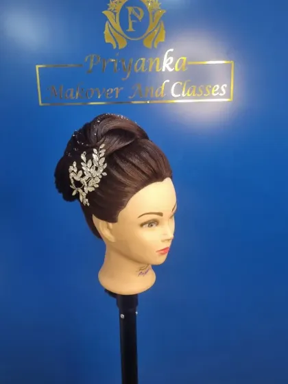 Practice makes perfect. In my classes, we use mannequin heads to master different techniques, from intricate Christian bridal updos and Russian flower buns to sleek Bollywood ponytails.