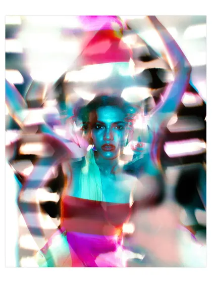 An abstract, experimental portrait using a prism or lens filter to create a fractured, colorful blur. This image transforms a simple setup into a vibrant, energetic piece of art.