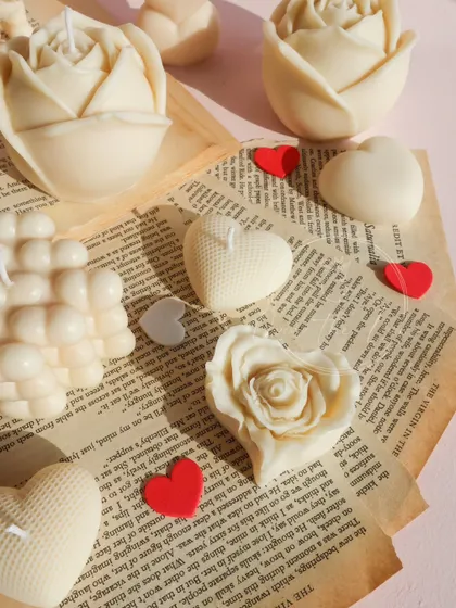 A close-up of the beautiful details in my ivory Valentine's candles, from textured hearts to delicate rose petals.