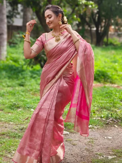 The beautiful movement of this pink linen saree. It's a lightweight and elegant fabric, and the custom blouse I designed ensures a perfect fit and a polished look.
