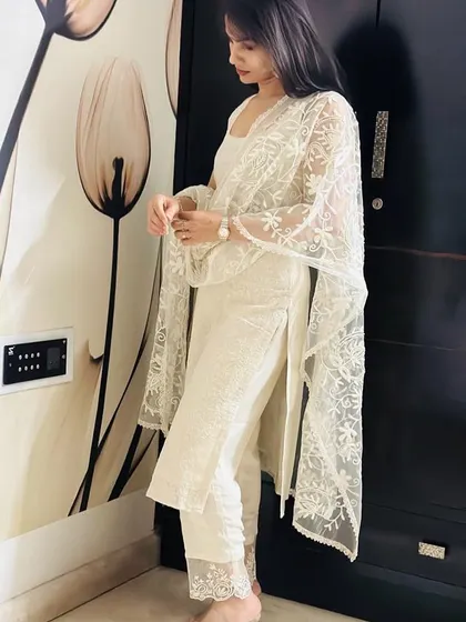 A classic and elegant choice. I designed this simple white chikankari suit with delicate lace detailing on the pants and a matching sheer dupatta for a timeless look.