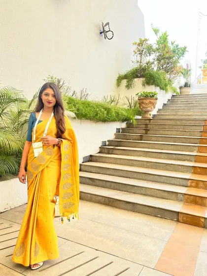 A full-length shot on the steps of the Electronica Productonica conference venue.