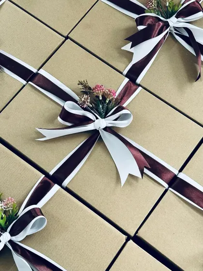 An overhead view of our corporate gift boxes, showing the consistent and beautiful wrapping style across the entire batch.