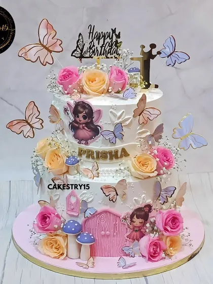 A magical fairy-themed cake for a first birthday. This 3kg pineapple cake is adorned with fresh roses, baby's breath, and a whimsical fairy door, creating a truly enchanting centerpiece.