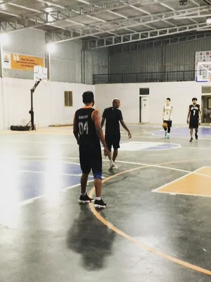 A moment between plays, with players getting into position. We welcome groups of all sizes to come and use our basketball court.