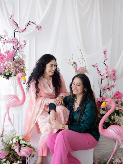 A candid moment of laughter between a mother and daughter. These are the unposed, genuine interactions that tell the real story of your family.