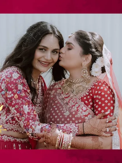 A sweet moment between the bride and her sister. The love and affection shared between them is what makes weddings so beautiful.