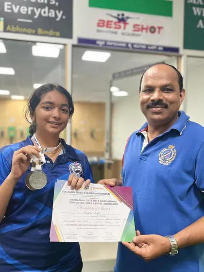 I am pictured here with Rishika, who won both silver and bronze medals at the CBSE South Zone Shooting competition in Kollam, Kerala.