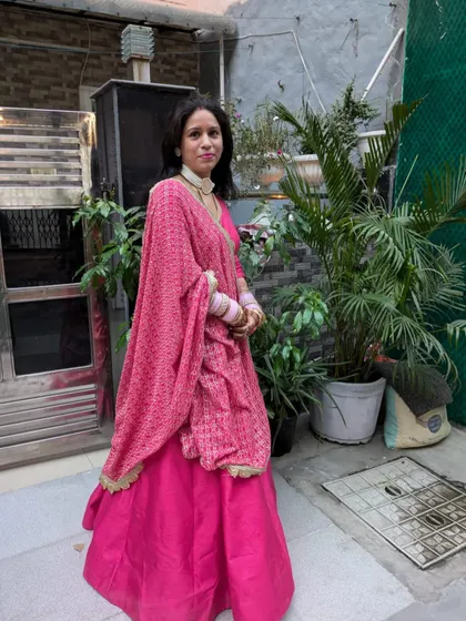Another shot of my client in her custom pink lehenga. This outfit is perfect for attending a wedding or a festive celebration, combining a classic color with detailed craftsmanship.