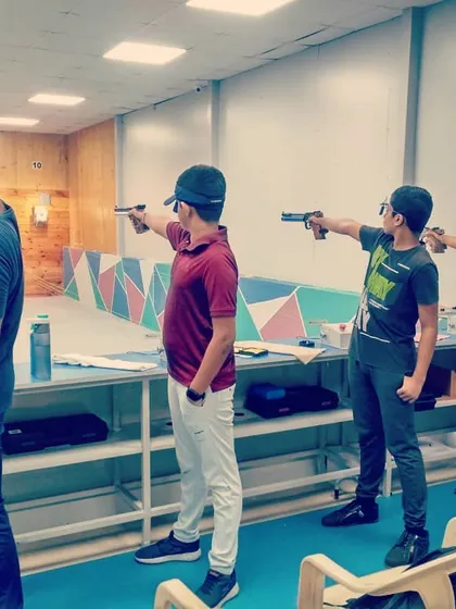 Shooters of different ages try their hand at 10-meter air pistol shooting. This discipline requires immense focus and a steady hand, and our coaches are there to guide you.