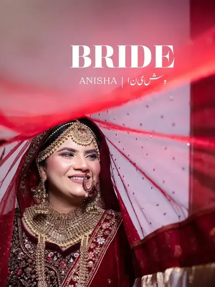 "BRIDE." A powerful portrait of the smiling bride under her red veil, capturing her beauty and joy.